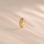 Gold nose ring with ornate filigree marquise design, ball detail
