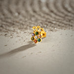 Lab grown diamond nose pin with multicolor floral design on textured surface