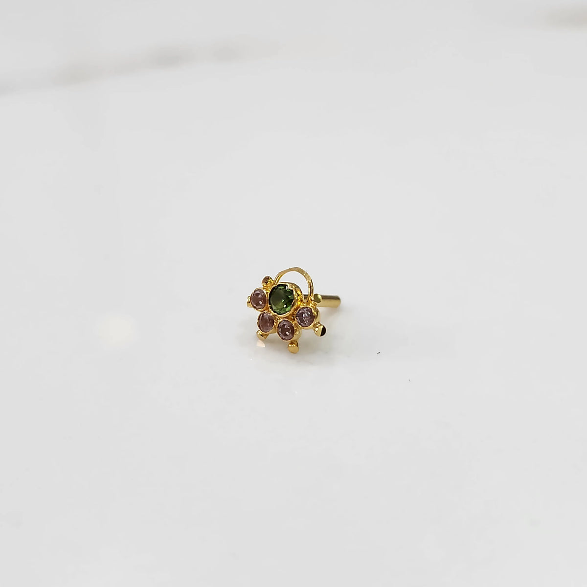 Handcrafted gold statement ring with mixed green and rose stone setting