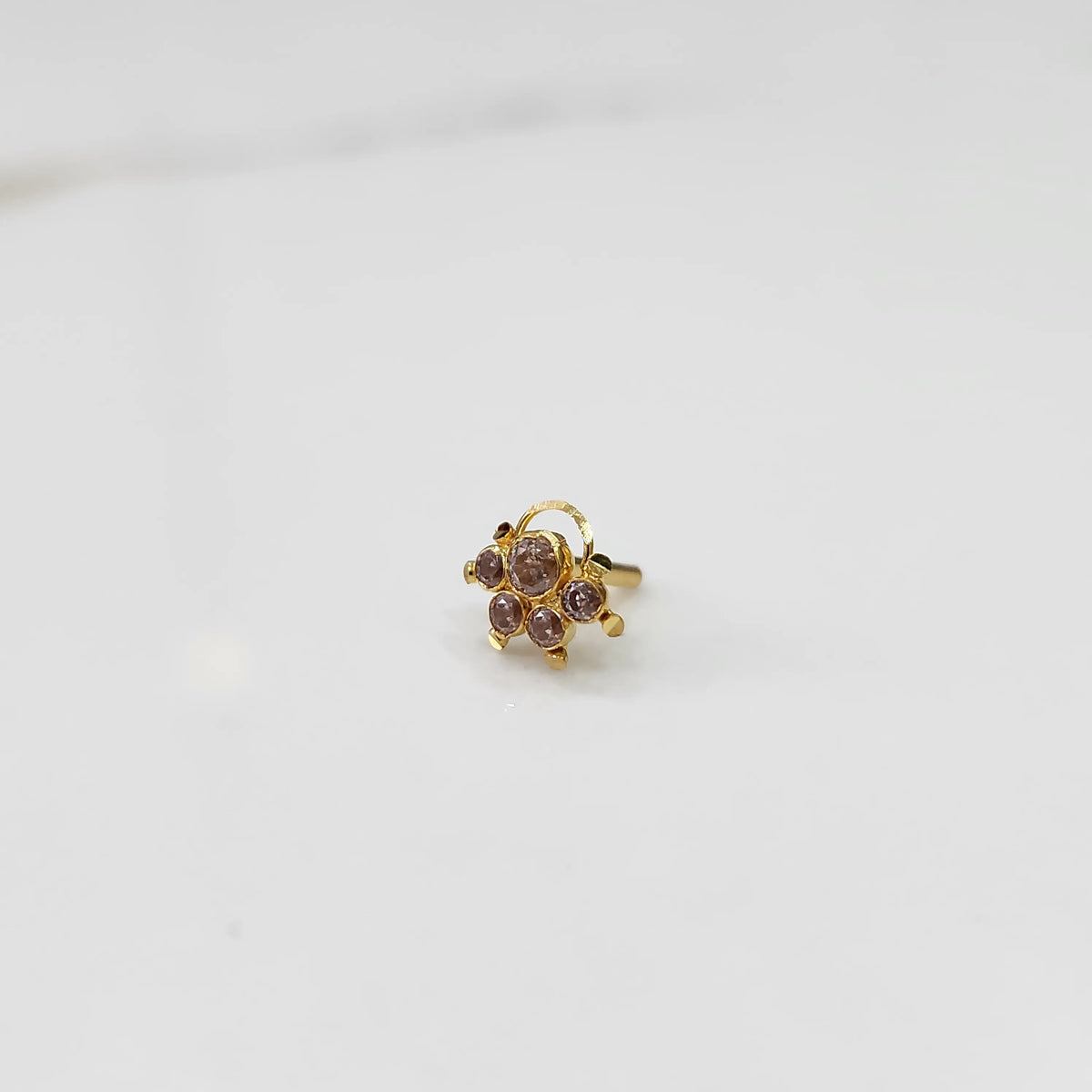 Gold ring with multicolor stone cluster in lilac and brown tones