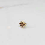 Gold ring with multicolor stone cluster in lilac and brown tones