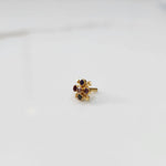Gold nose pin with multicolor gemstone flower cluster on white background