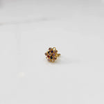 Gold nose pin with multicolor gemstone mandala design on white background