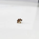 Front view of gold ring featuring purple floral gemstone petals