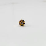 Gold statement ring with multicolor gemstones in round cluster setting