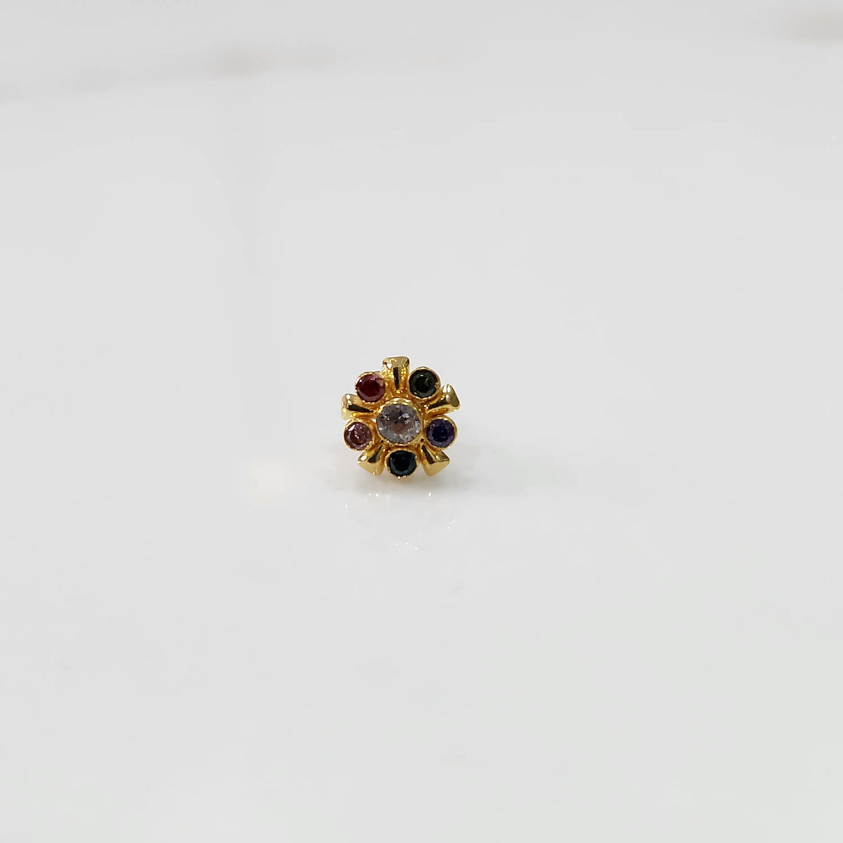 Gold statement ring with multicolor gemstones in round cluster setting