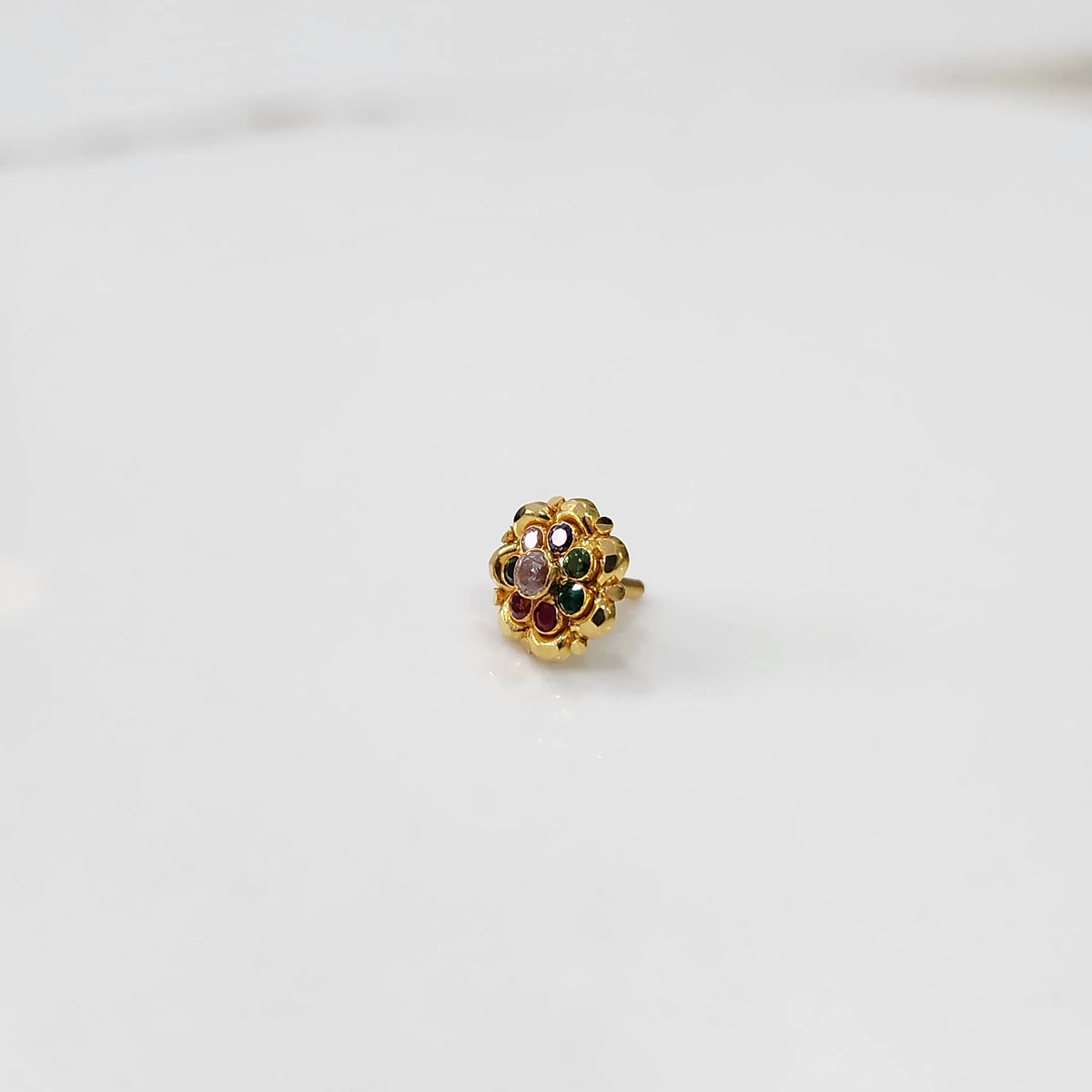 Gold floral ring with navratna multicolor stone setting