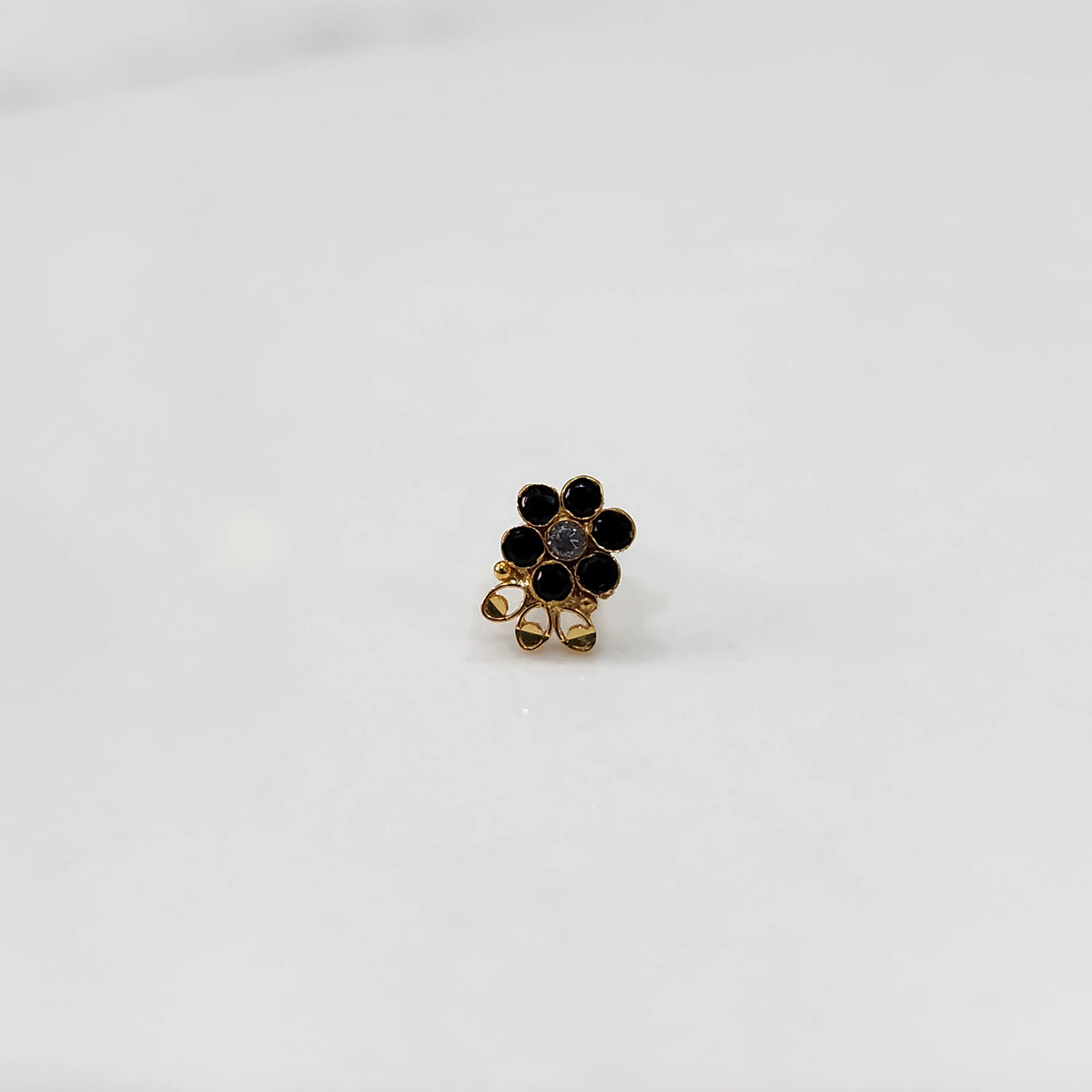 Close up lab grown diamond nose pin multicolor stones on white background