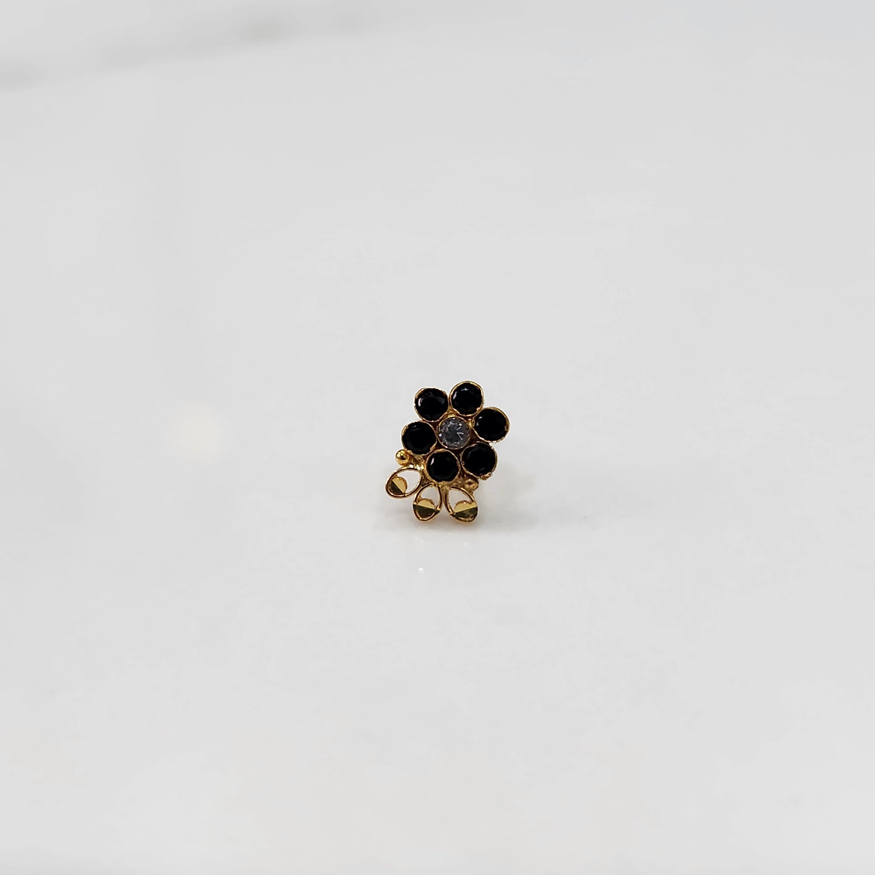 Close up lab grown diamond nose pin multicolor stones on white background