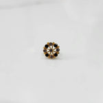 Gold floral nose pin with black and clear stone accents