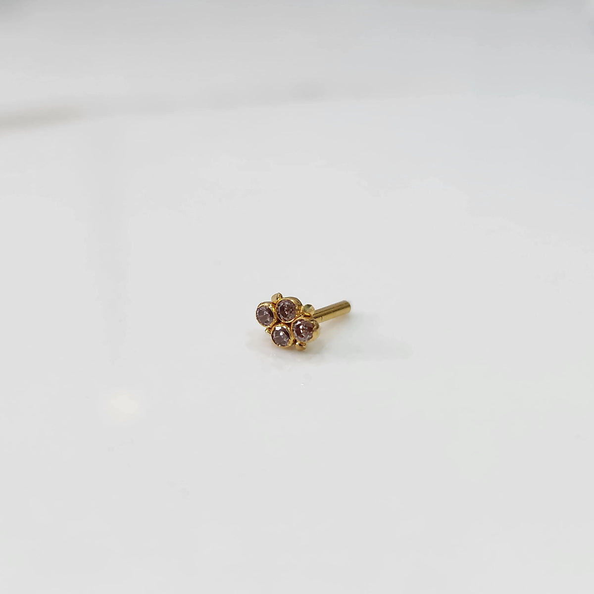 Gold nose pin with small all-champagne stone cluster