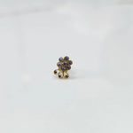 Gold nose pin with champagne stone cluster and curling swirl accent detail