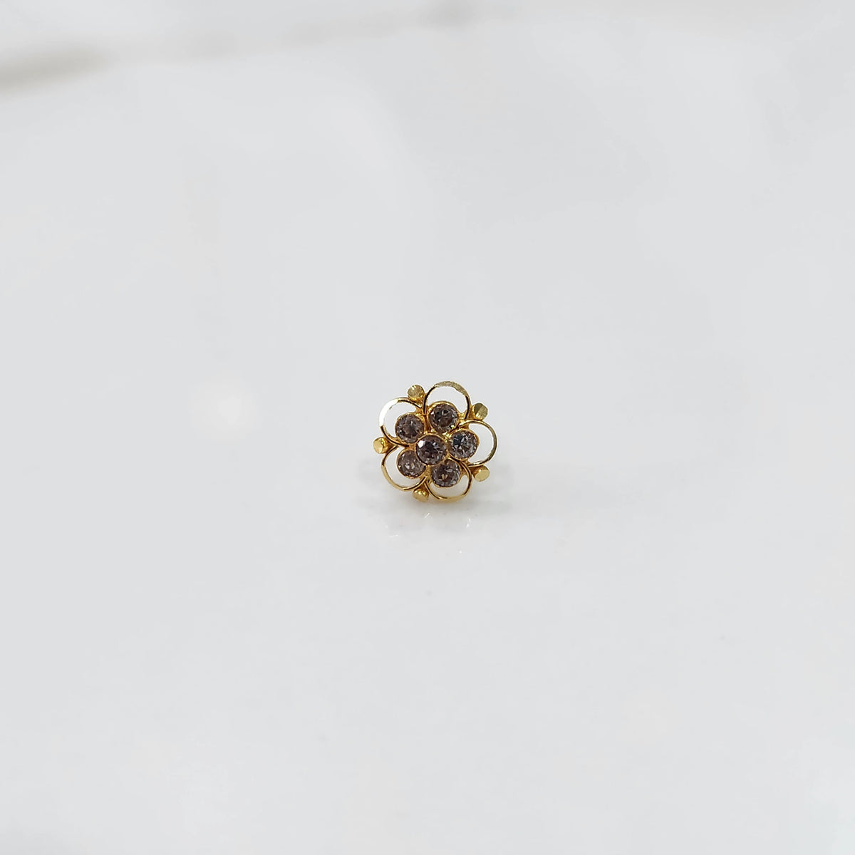 Gold floral nose pin with clear stone cluster