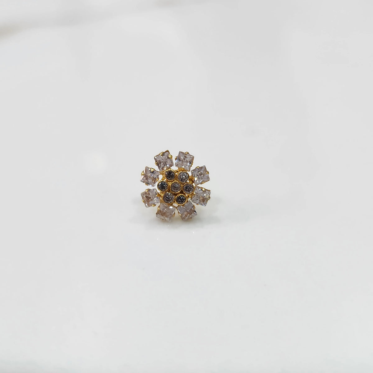 Gold nose pin design with white floral diamond cluster