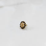 Gold nose pin design with circular floral diamond pattern