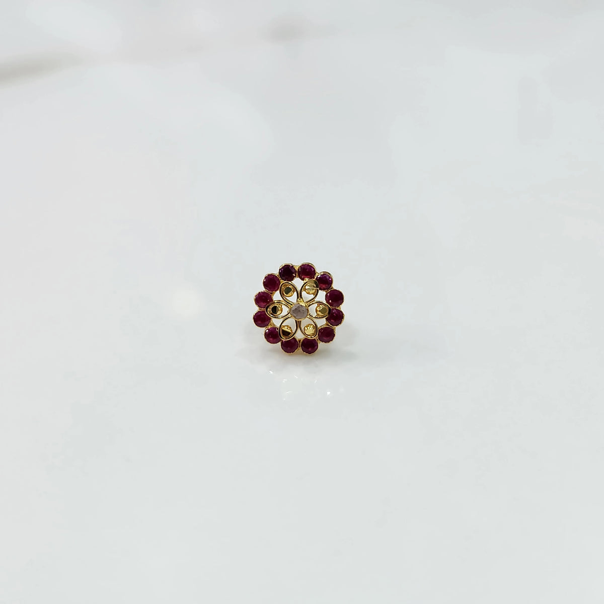 Gold nose pin with double-layer ruby and champagne stone floral petals