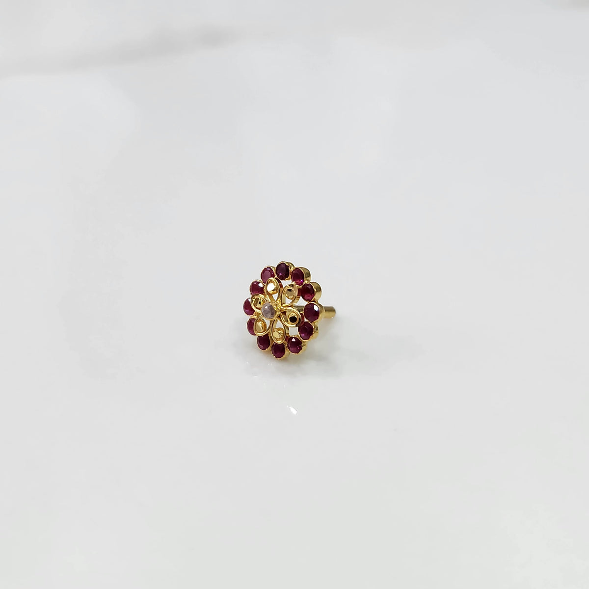 Gold nose pin with double-layer ruby stone floral petals and clear center stones