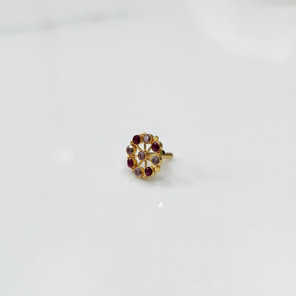Top view gold pin nose with multicolor floral stones