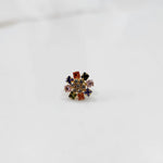 Gold nose pin with navratna square-cut multicolor stone petals and clear center