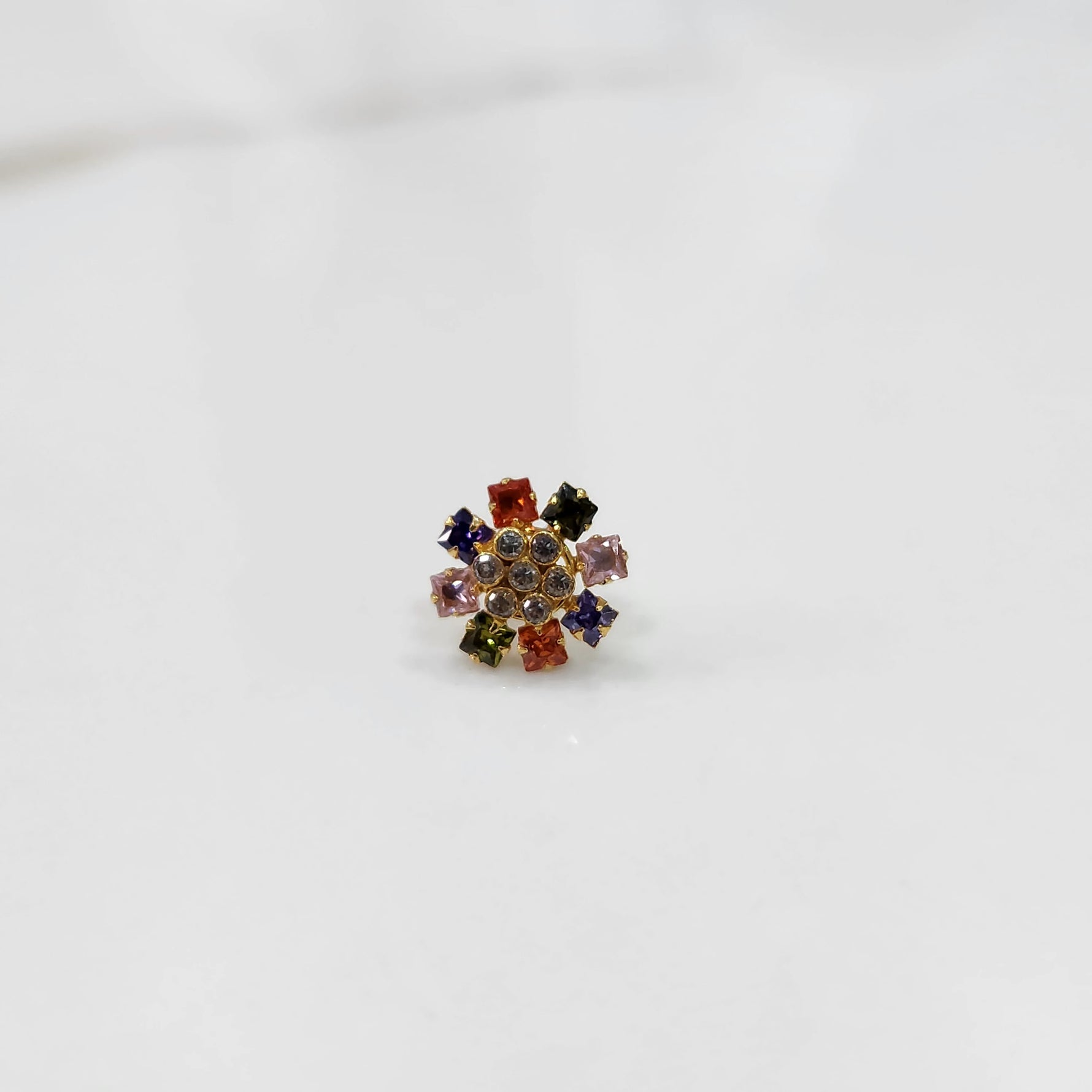 Gold nose pin with navratna square-cut multicolor stone petals and clear center