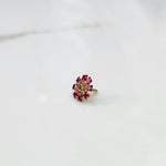 Gold nose pin with ruby square-cut and round-cut stone petals