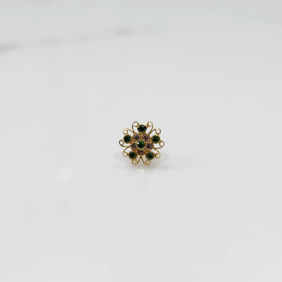 Nose pin new design gold with green stone floral pattern on white background