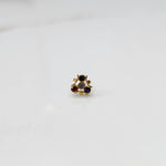 Gold nose pin with navratna multicolor stones in organic branch-style setting