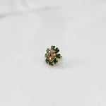 Gold nose pin with green square-cut stones and purple round center stones