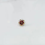 Gold floral nose pin with magenta stones and clear center stone