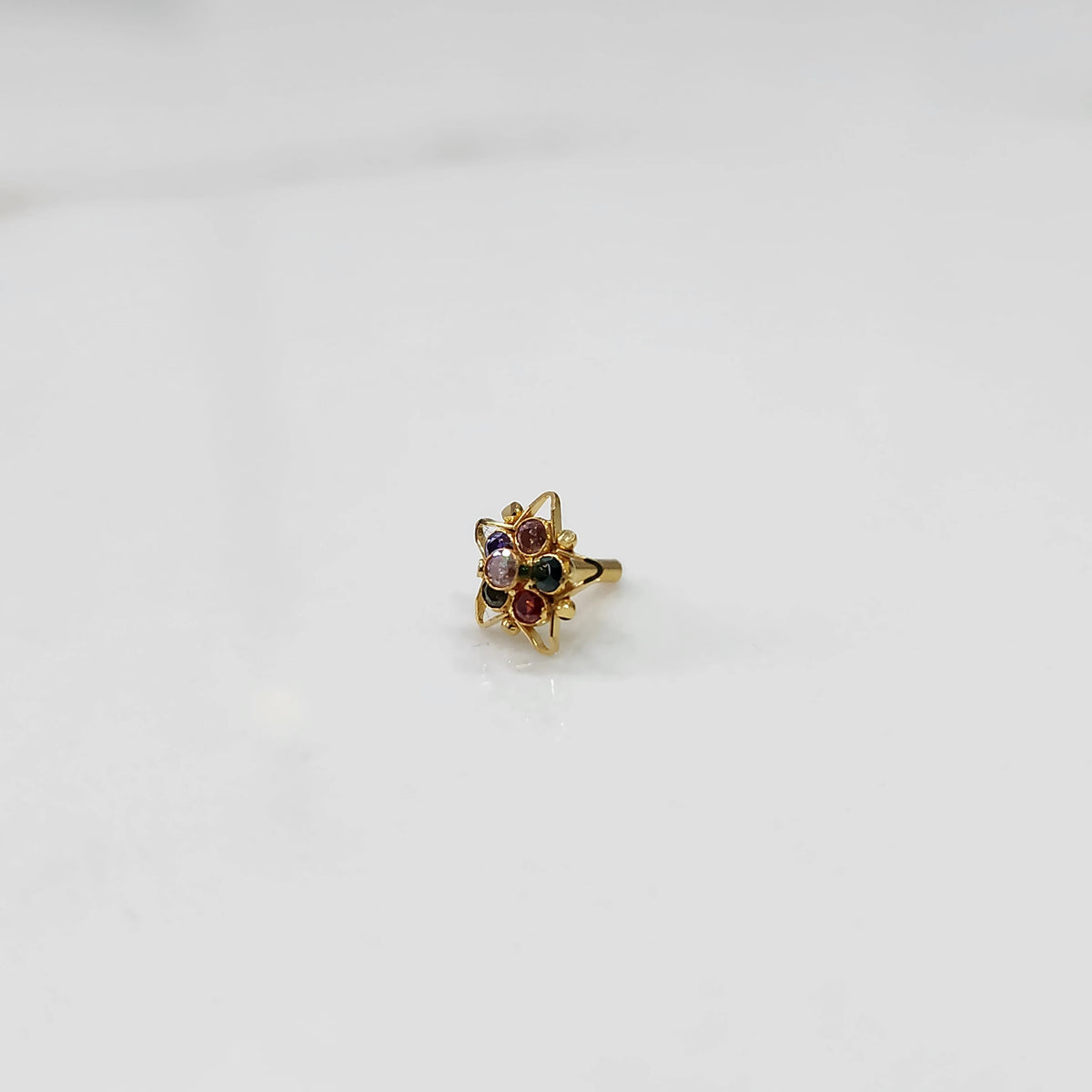 Side view nose pin design gold with multicolor gemstone setting