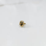 Gold floral nose pin with multicolor gemstones and open swirl border