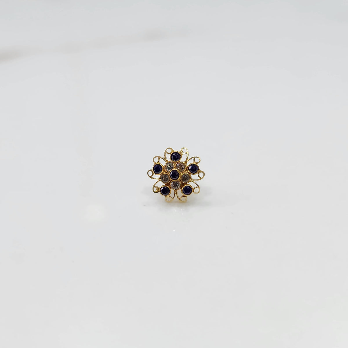 Nose pin new design gold with red floral stone pattern on white background