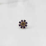 Gold nose pin with purple square-cut stones and clear round center stones