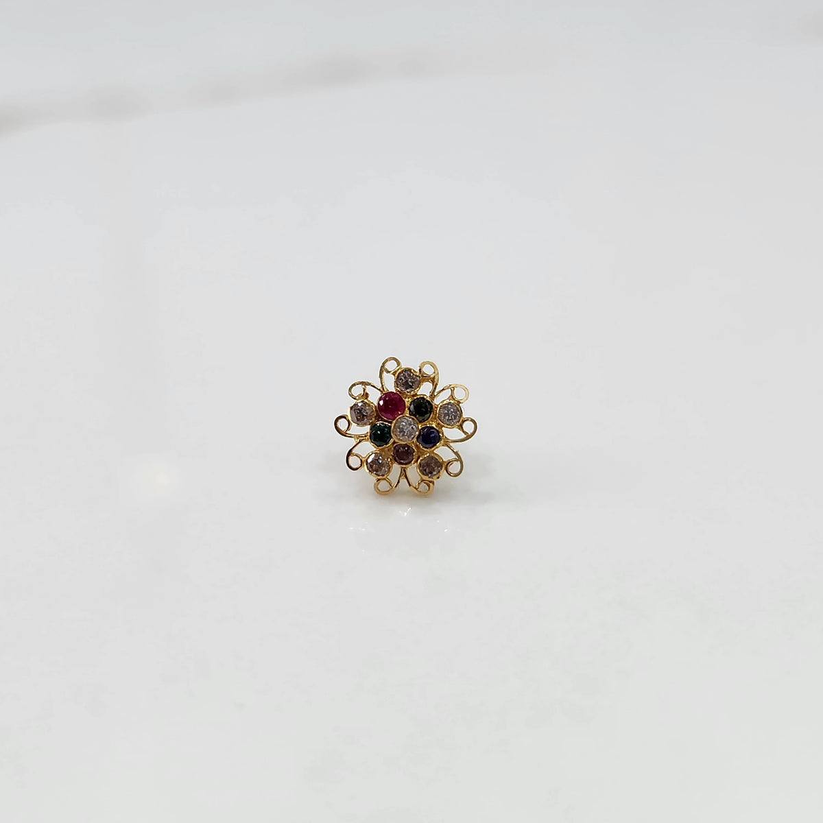 Nose pin new design gold with elegant floral cluster angled view