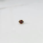Gold nose pin with small ruby and champagne stone cluster