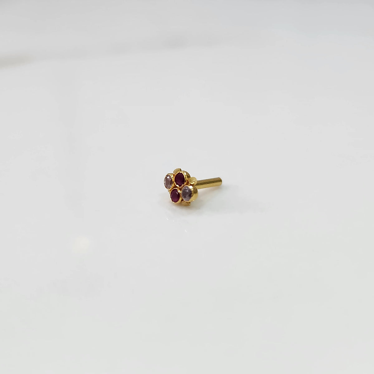 Women's gold nose pin design side angle with floral cluster