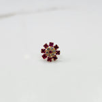 Gold nose pin with ruby square-cut stones and clear round center stones