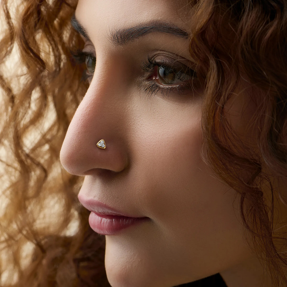 Gold Nose Pin worn by a woman highlighting a delicate and elegant everyday style