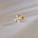 Round floral cluster gold nose pins with marquise and round diamonds on soft background