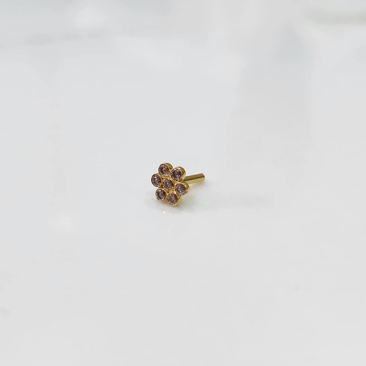Front view nose pin design gold with small floral cluster design