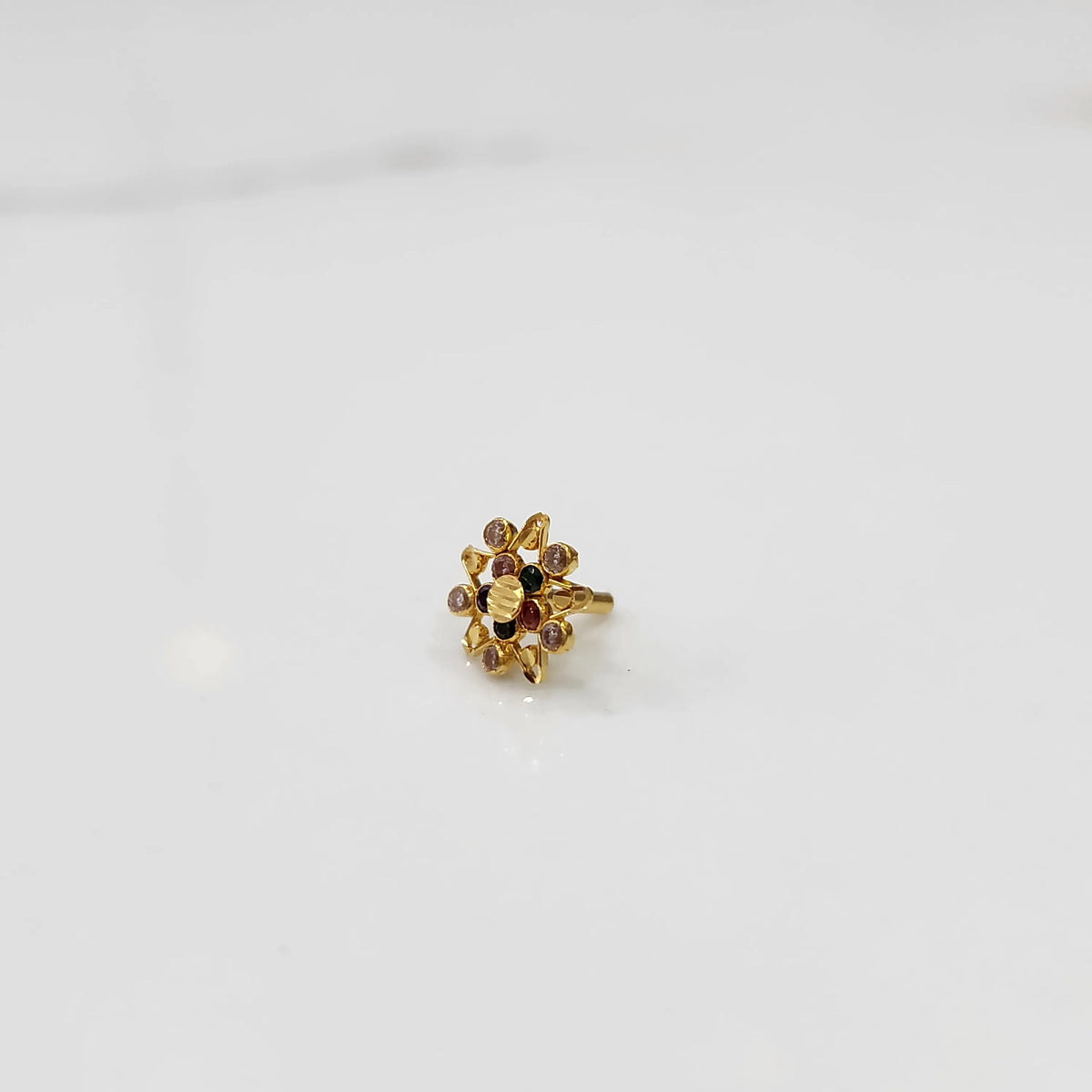 Gold pointed petal ring with brown and pink round stones