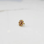 Gold pointed petal ring with red center and clear round stones