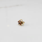 Gold ring with multicolor stone cluster in pink, red and black