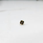 Gold ring with green emerald round floral design, front view