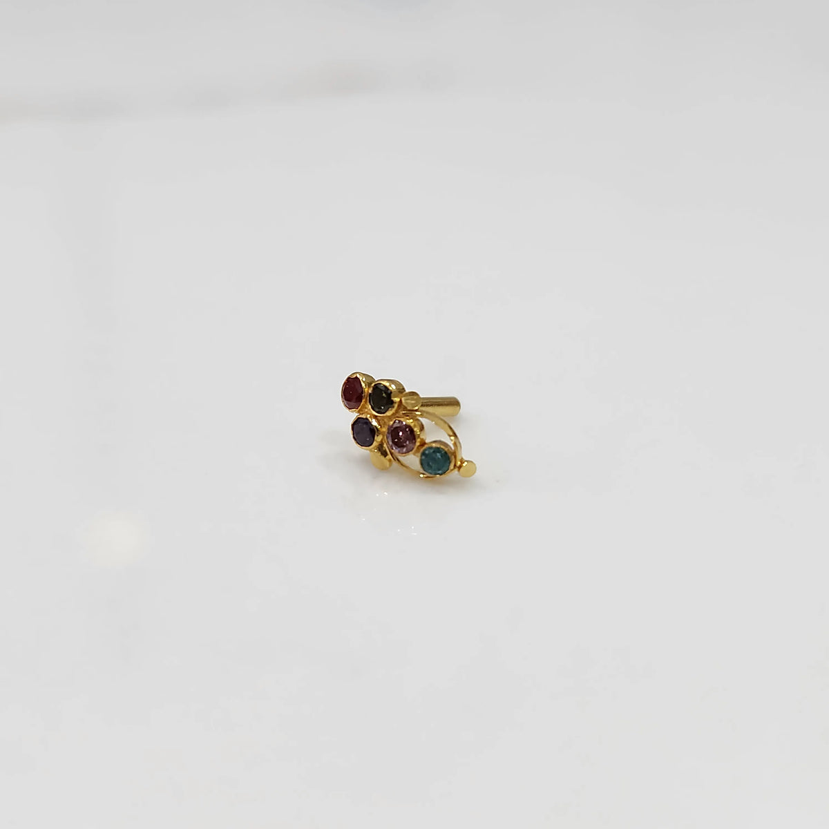Gold ring with multicolor round gemstone cluster design
