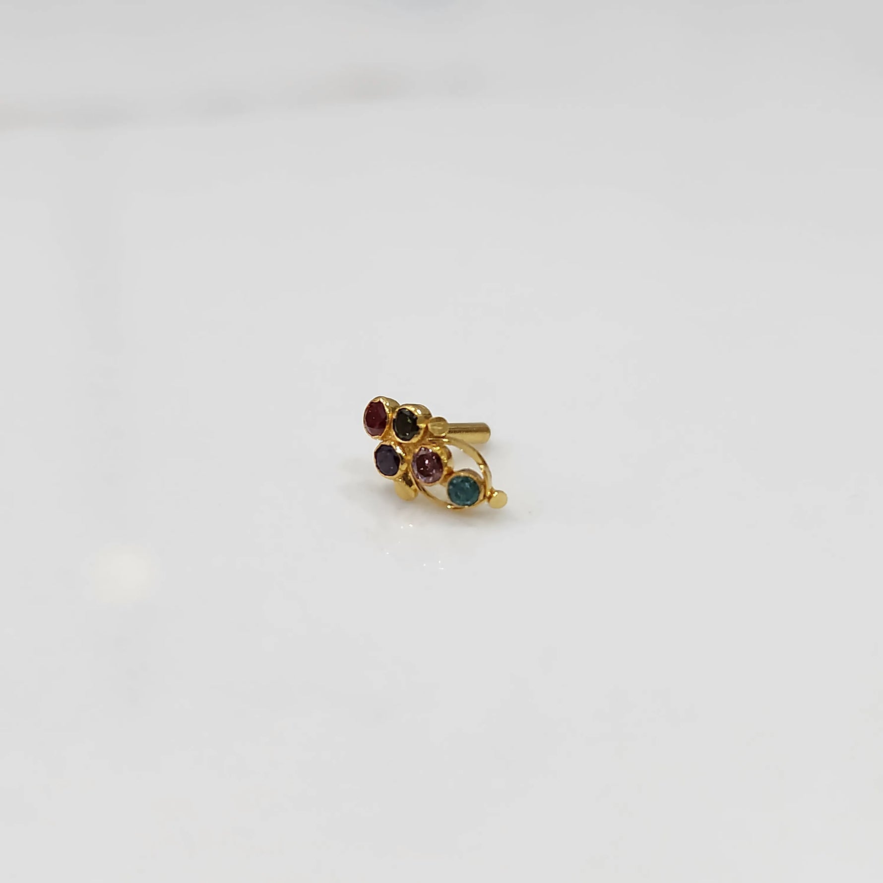 Gold ring with multicolor round gemstone cluster design