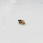Gold ring with purple and clear round gemstone cluster design