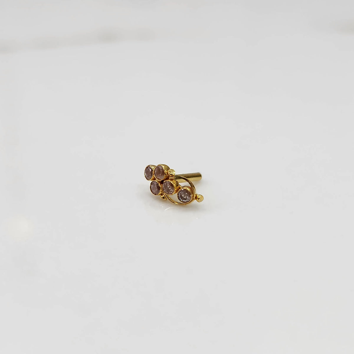 Gold ring with purple round gemstone cluster design
