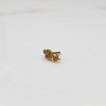Gold ring with purple round gemstone cluster design