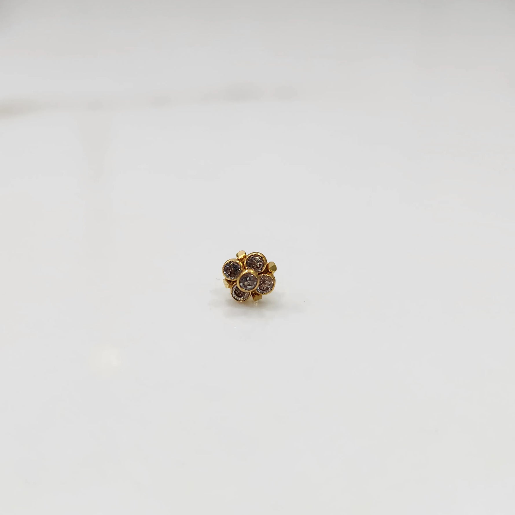 Gold ring with smoky quartz round floral design, front view